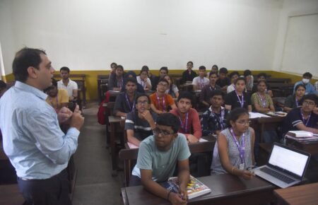 college classroom attendance students sitting lecture india university