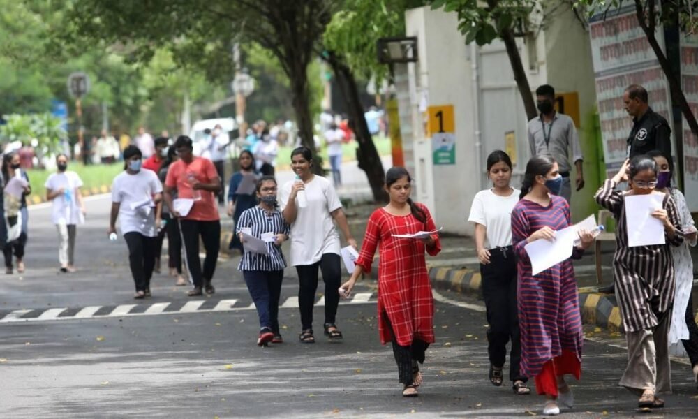Students participating in university admission and entrance examination activities in India.