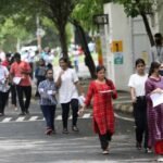 Students participating in university admission and entrance examination activities in India.