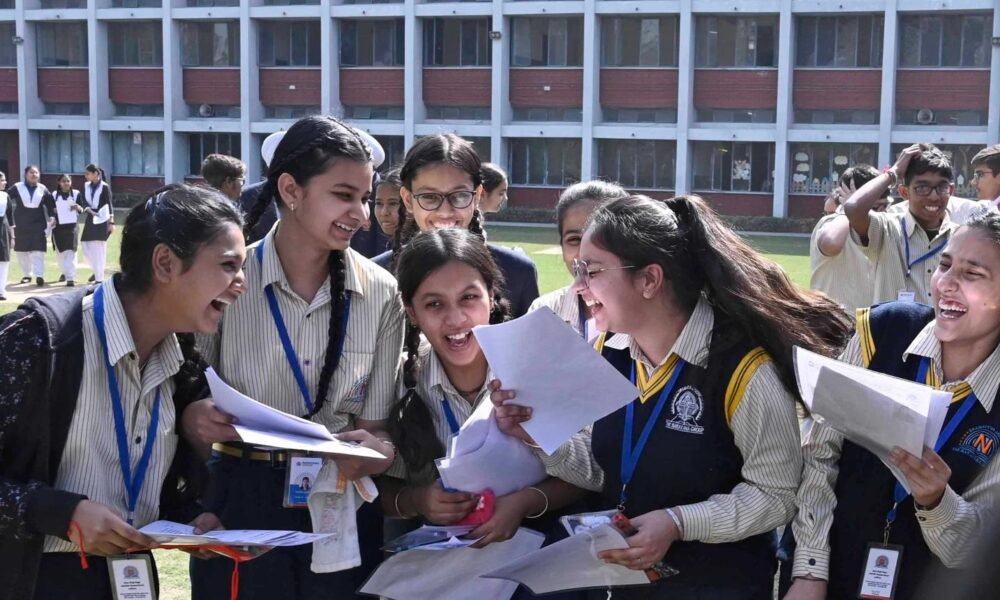 Indian students checking CBSE Class 12 board examination results online