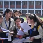 Indian students checking CBSE Class 12 board examination results online