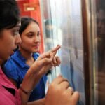 Students checking and celebrating CBSE Class 12 Results 2026