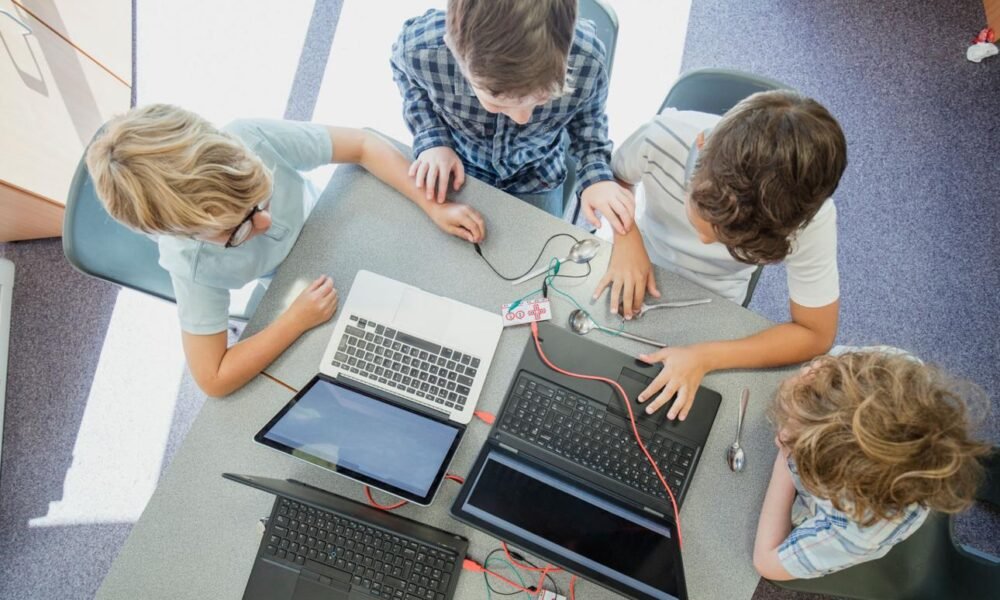 Alt Text: Students learning through digital classroom and skill education programmes in India.