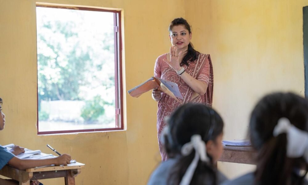 Teacher conducting a classroom session with students in an Indian school.