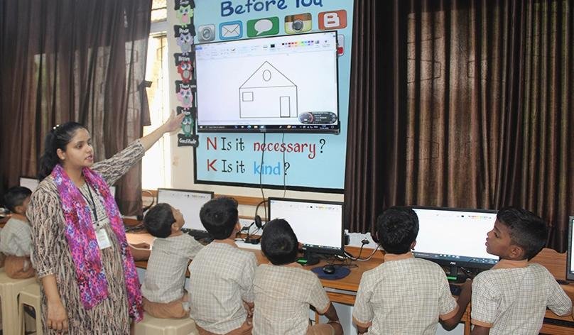 Students attending a cyber safety awareness session in a school.