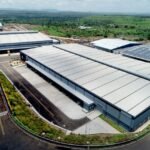 Gujarat Unveils New Industrial Policy to Attract Mega Investments and Accelerate Infrastructure Growth Industrial infrastructure and manufacturing facilities in Gujarat.