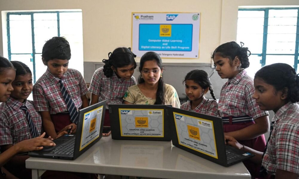 Students learning media literacy and digital information verification skills in a classroom.