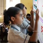 Students learning in a technology-enabled digital classroom.