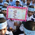 : Students participating in a water conservation awareness programme in a school