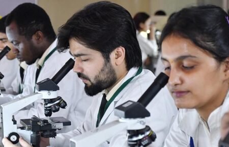 University students engaged in research and innovation activities.