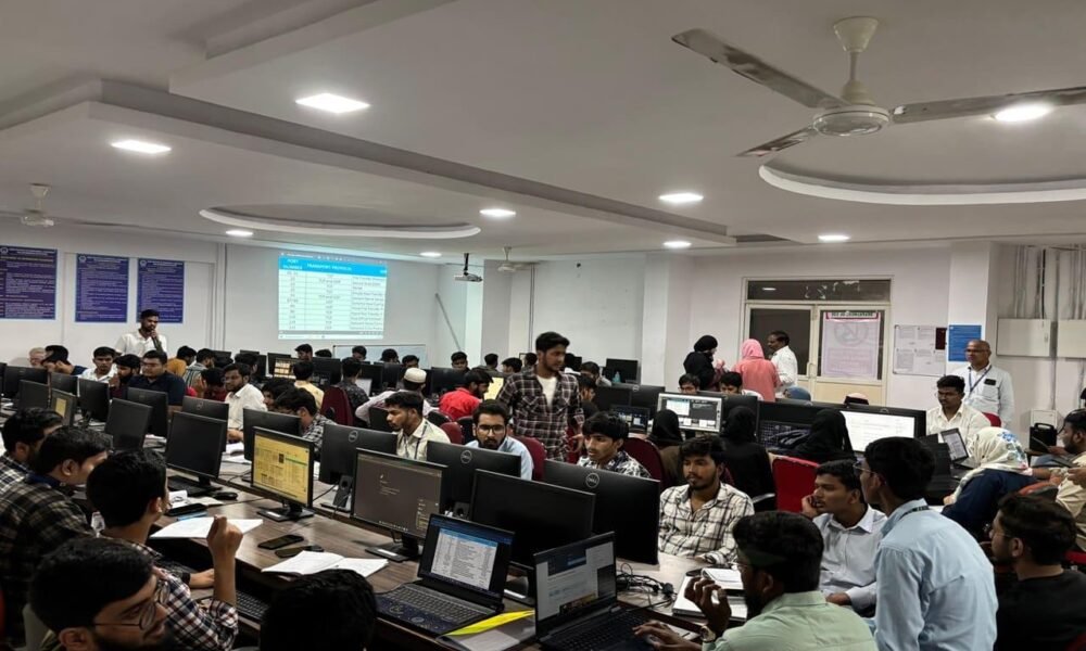 College students learning cybersecurity and information security concepts in a technology lab.