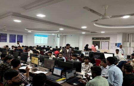 College students learning cybersecurity and information security concepts in a technology lab.