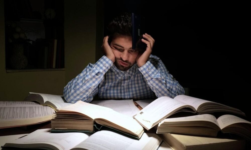 Student studying during exam preparation with counselling and wellbeing support theme.