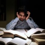 Student studying during exam preparation with counselling and wellbeing support theme.