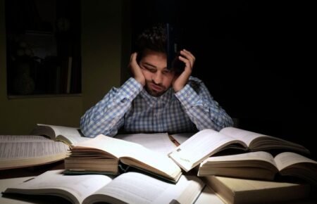 Student studying during exam preparation with counselling and wellbeing support theme.