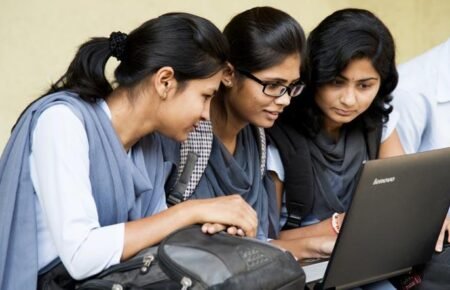Students checking their Class 10 examination results online.