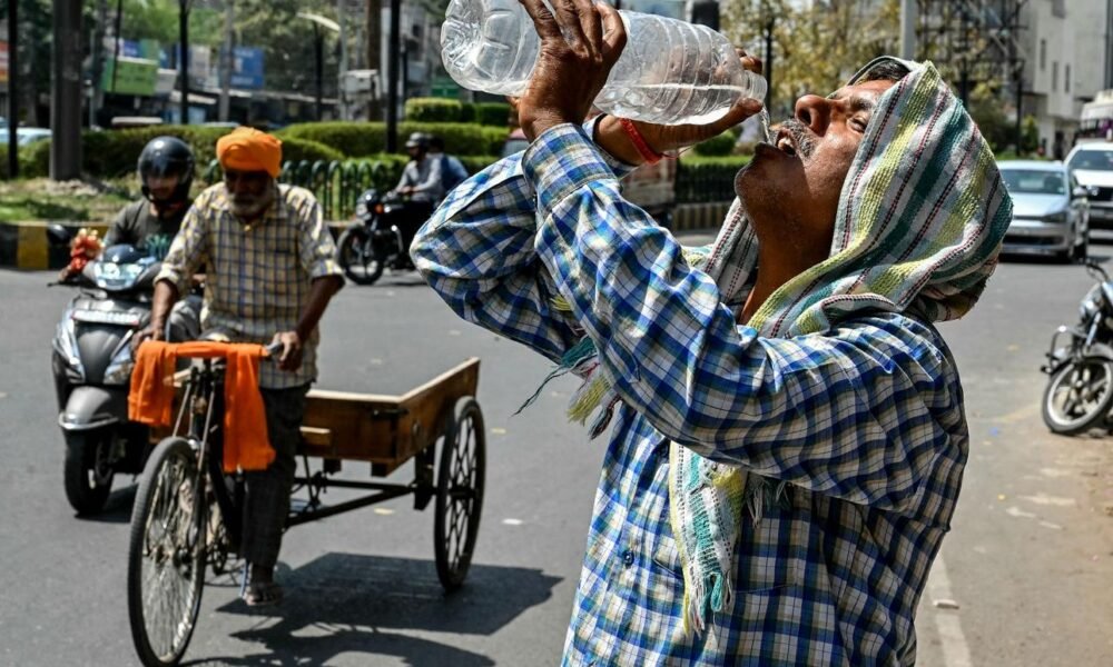 Healthcare professionals treating a patient affected by extreme heat.