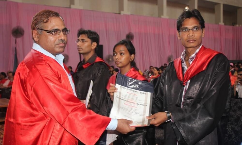 University students receiving degree certificates during graduation.