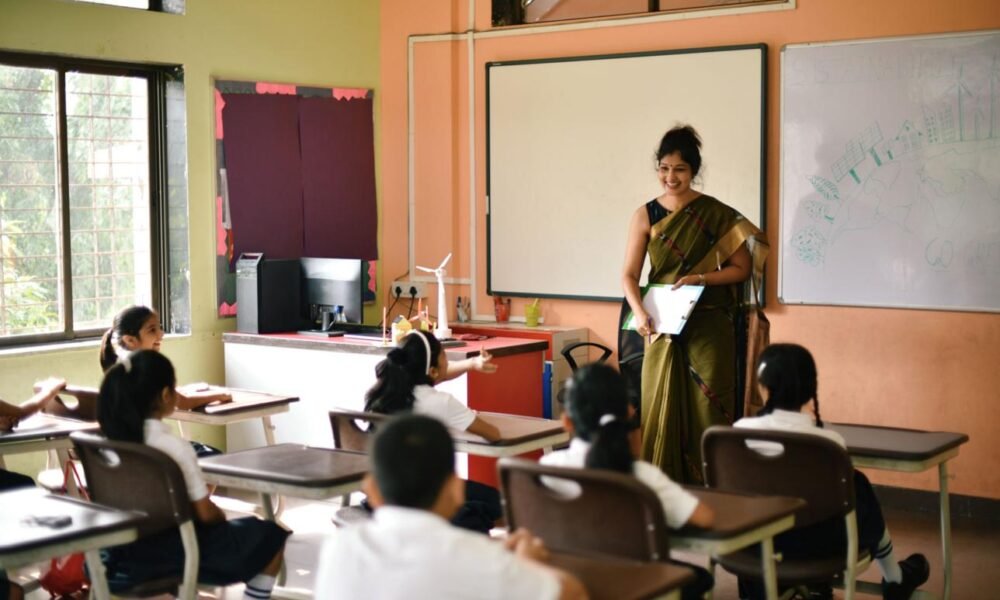 Teacher conducting a classroom session with students in an Indian school.