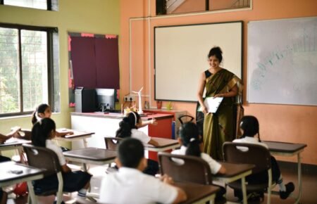 Teacher conducting a classroom session with students in an Indian school.