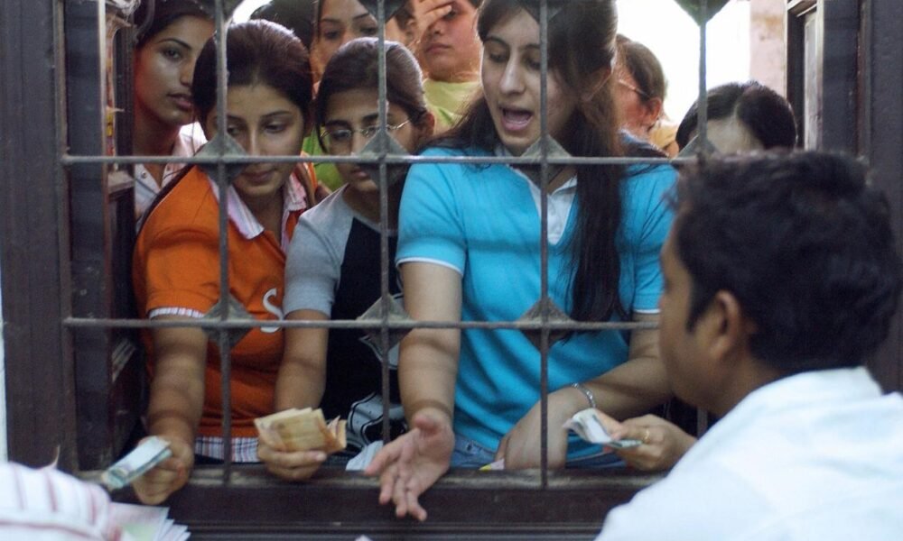 Students participating in university admission and counselling activities in India.
