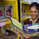 Primary school students participating in a reading activity in Uttar Pradesh.