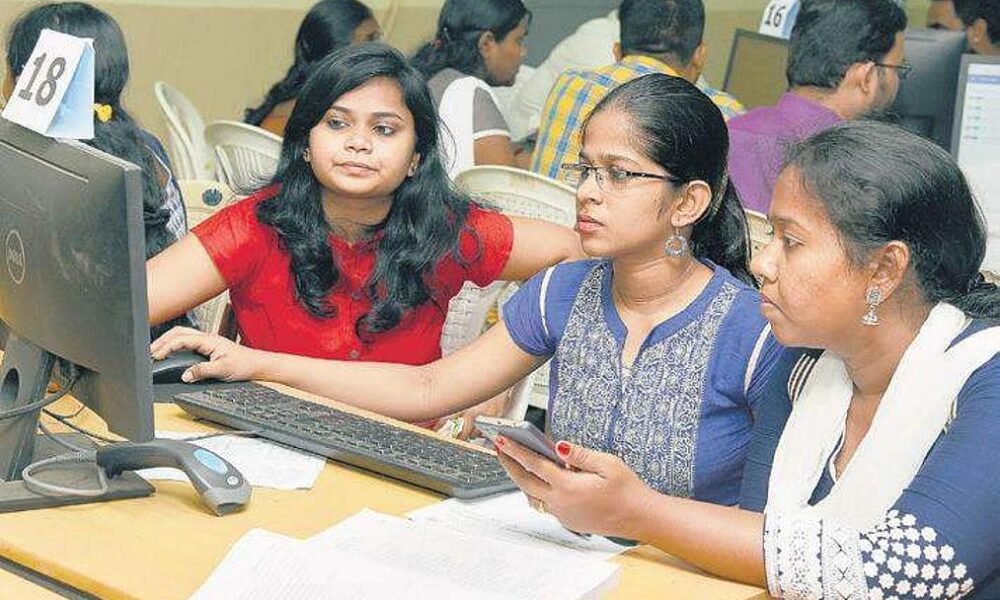Engineering aspirants checking their JoSAA seat allotment results online.