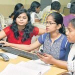 Engineering aspirants checking their JoSAA seat allotment results online.