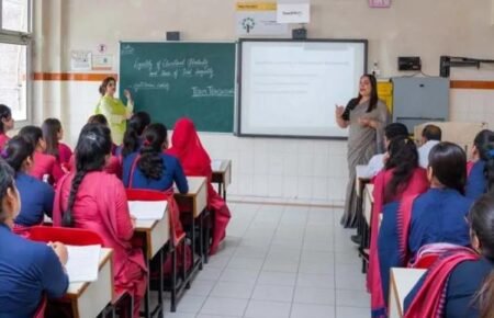 Students attending a teacher education programme in a college classroom.