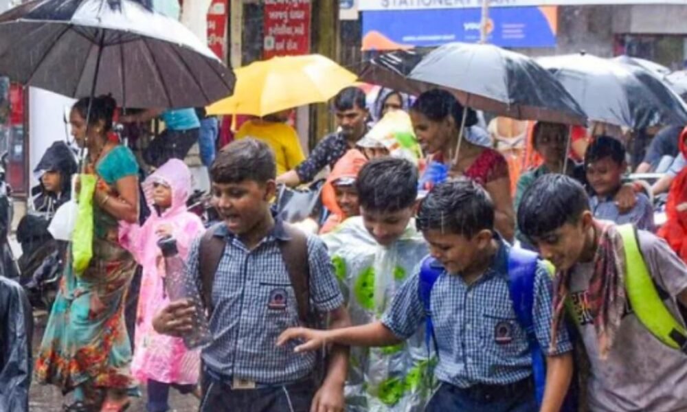 Students returning to school in Mumbai after heavy monsoon rainfall.